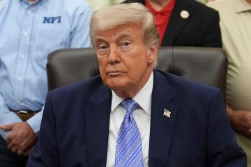 Donald Trump at a podium while Republicans react to a DOJ fund dispute