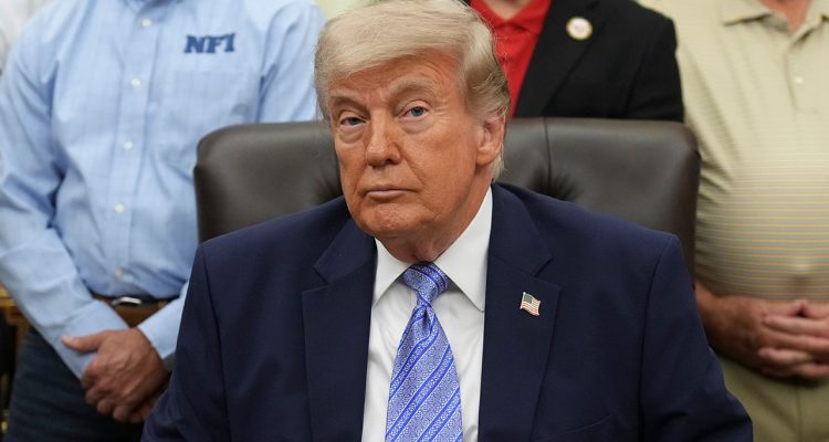 Donald Trump at a podium while Republicans react to a DOJ fund dispute