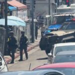 Federal agents during a major drug raid at MacArthur Park in Los Angeles