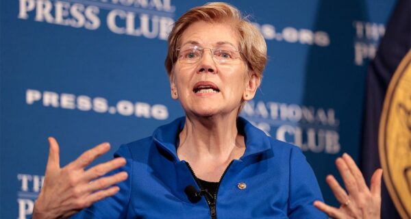 Elizabeth Warren speaking at a Senate event on tax filing policy