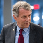 Sherrod Brown speaking at a campaign event amid border security criticism