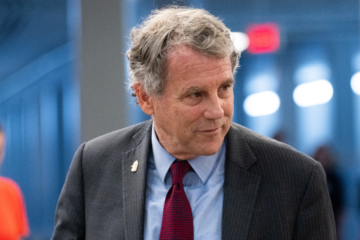 Sherrod Brown speaking at a campaign event amid border security criticism