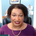Stacey Abrams speaking while defending the SPLC
