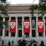 Harvard campus buildings with a story about student mental health and college debt