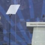 Hillary Clinton bundled up in a coat and scarf at the Obama Presidential Center opening ceremony in Chicago