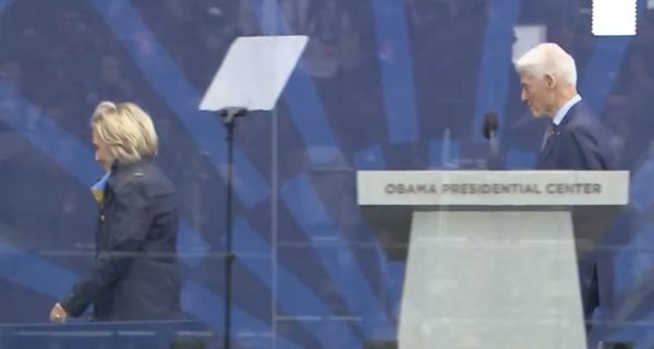 Hillary Clinton bundled up in a coat and scarf at the Obama Presidential Center opening ceremony in Chicago