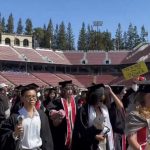 Stanford graduates walking out during Sundar Pichai’s commencement speech at Stanford Stadium