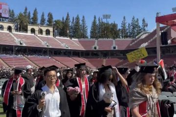 Stanford graduates walking out during Sundar Pichai’s commencement speech at Stanford Stadium