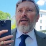 Thomas Massie speaking to a reporter during a confrontation in Washington, D.C.