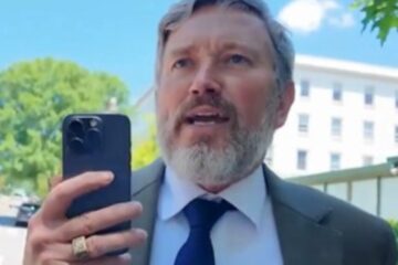 Thomas Massie speaking to a reporter during a confrontation in Washington, D.C.