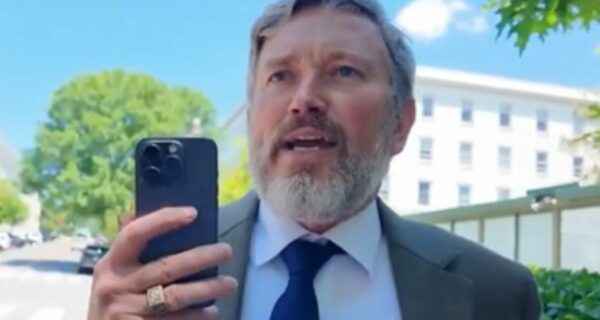 Thomas Massie speaking to a reporter during a confrontation in Washington, D.C.