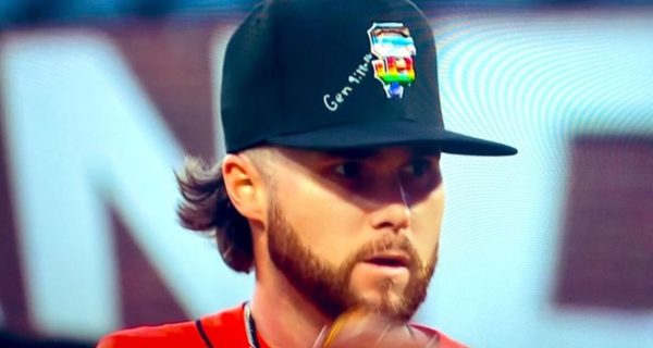 San Francisco Giants players wearing Pride Night caps during a game
