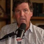 Tucker Carlson speaking during a podcast appearance