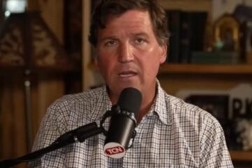 Tucker Carlson speaking during a podcast appearance