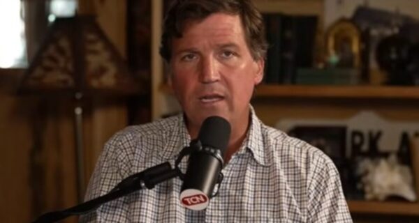 Tucker Carlson speaking during a podcast appearance