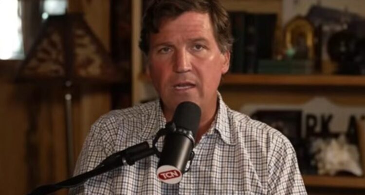 Tucker Carlson speaking during a podcast appearance