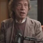 Mick Jagger performing on stage with the Rolling Stones