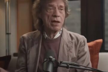 Mick Jagger performing on stage with the Rolling Stones