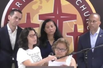Margarita Cielo Balbuena speaks through a translator at a Democratic press conference while demanding a path to citizenship