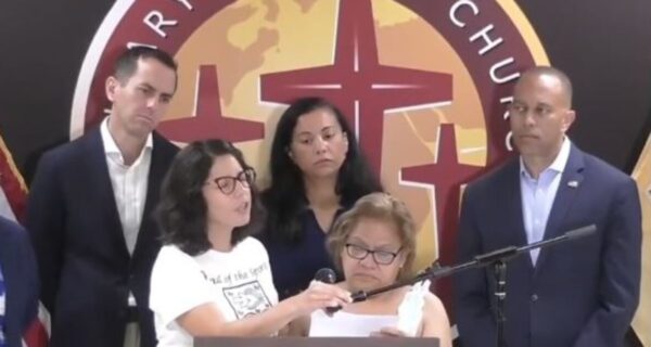 Margarita Cielo Balbuena speaks through a translator at a Democratic press conference while demanding a path to citizenship