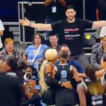 Enes Kanter Freedom wearing a woman adult human female shirt at a WNBA game