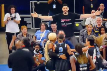Enes Kanter Freedom wearing a woman adult human female shirt at a WNBA game