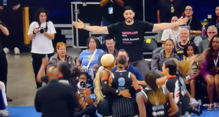 Enes Kanter Freedom wearing a woman adult human female shirt at a WNBA game