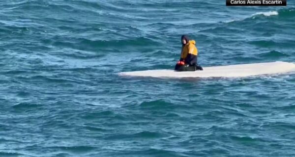 A 15-year-old Alaska boy is rescued after surviving days on an overturned fishing skiff in the Bering Sea