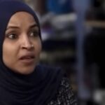 Ilhan Omar seated inside a Teamsters Union semi-truck for a Labor Day photo-op