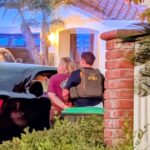 FBI agents arrest former high school football nonprofit treasurer Julie Hanway Molina outside her Aliso Viejo home