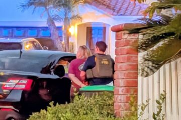 FBI agents arrest former high school football nonprofit treasurer Julie Hanway Molina outside her Aliso Viejo home
