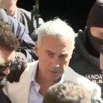Călin Georgescu escorted in handcuffs after a Romanian police raid