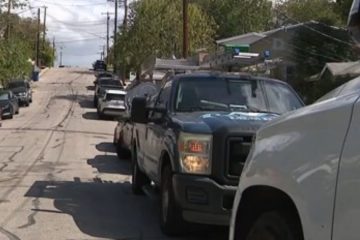 Protesters gather outside a home near Huston-Tillotson University after an East Austin parking dispute