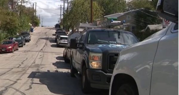 Protesters gather outside a home near Huston-Tillotson University after an East Austin parking dispute