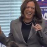 Kamala Harris laughs during a campaign event with Richard Pan as staffers sit quietly